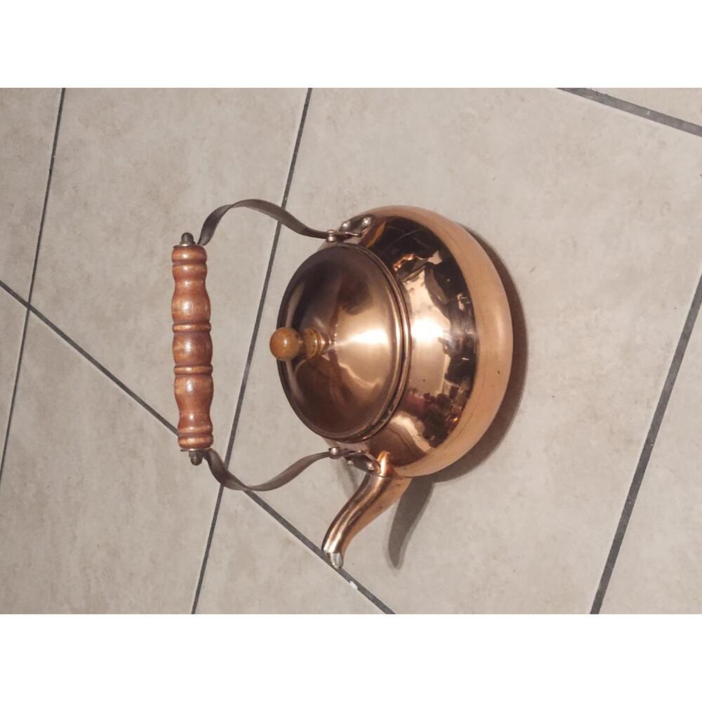 Vintage copper tea kettle with wooden handle
